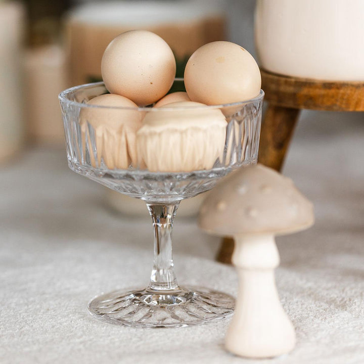 Yellow Phalaenopsis orchid in a yellow Simplicity pot on a bamboo plate, part of Everspring's Kolibri Orchids gift set.
